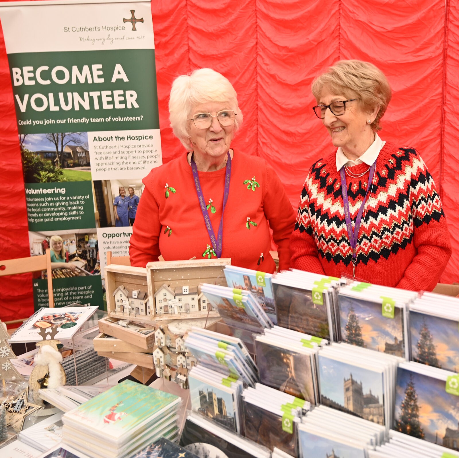 Two ladies selling Christmas cards