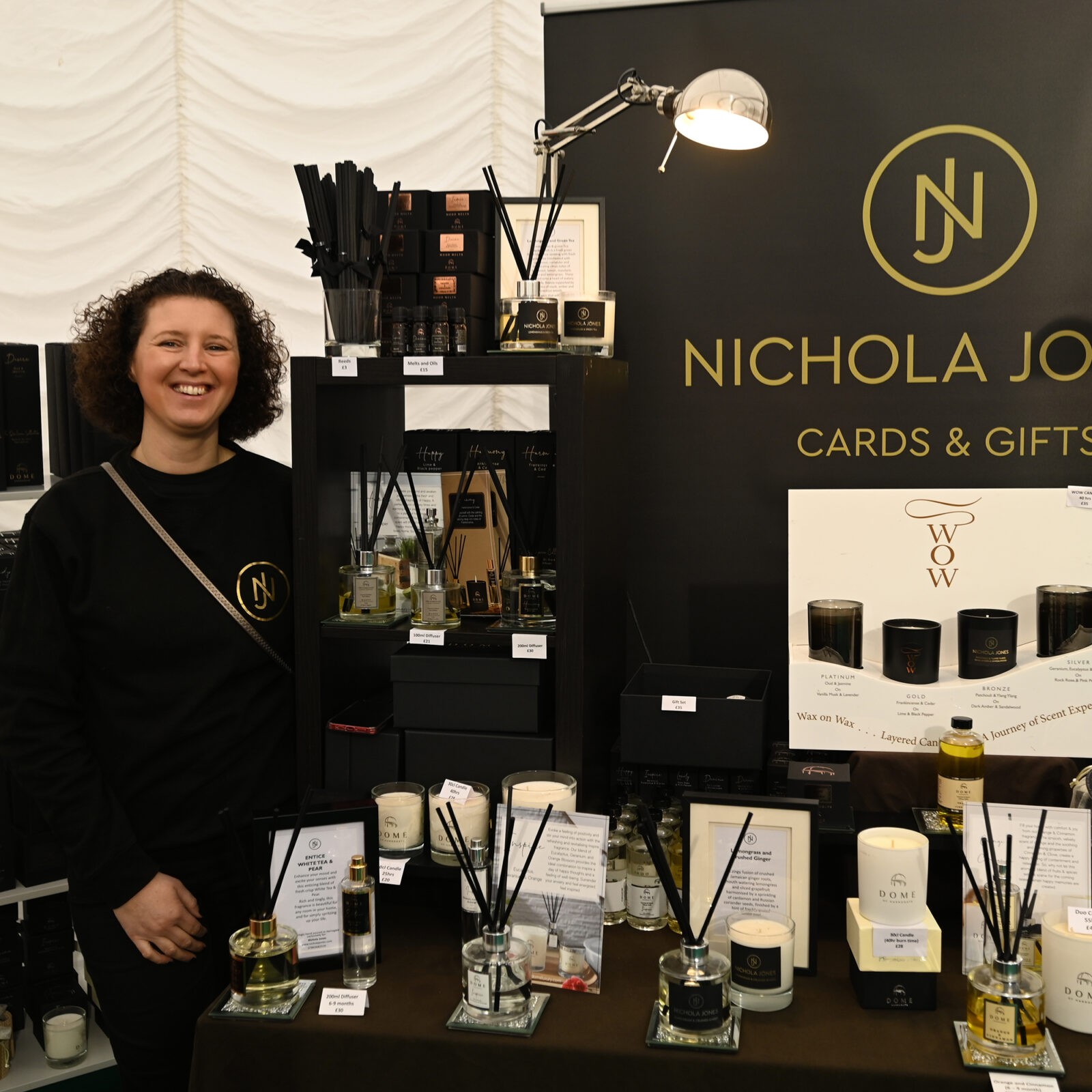 A lady selling candles and diffusers