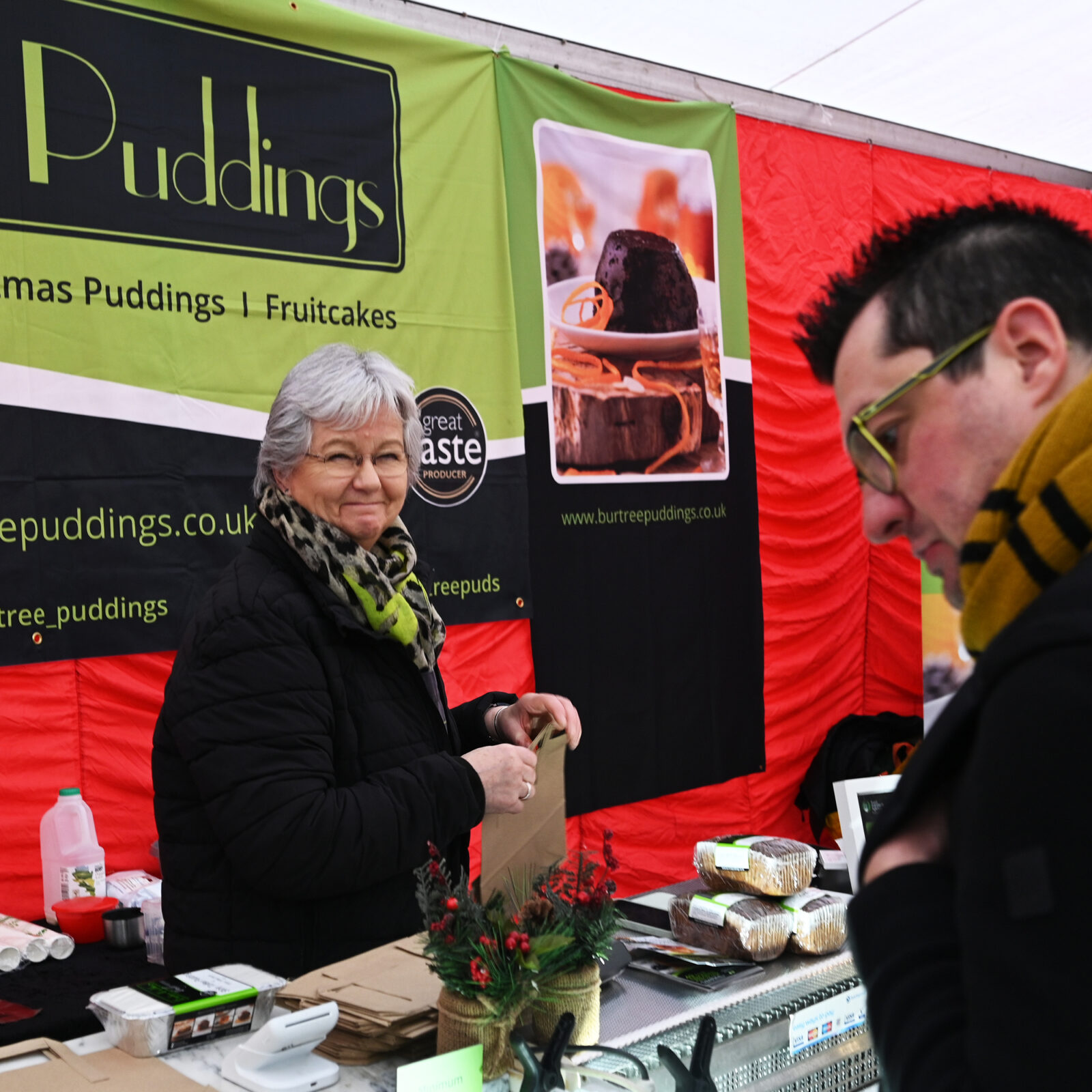 A lady selling Burtree Puddings