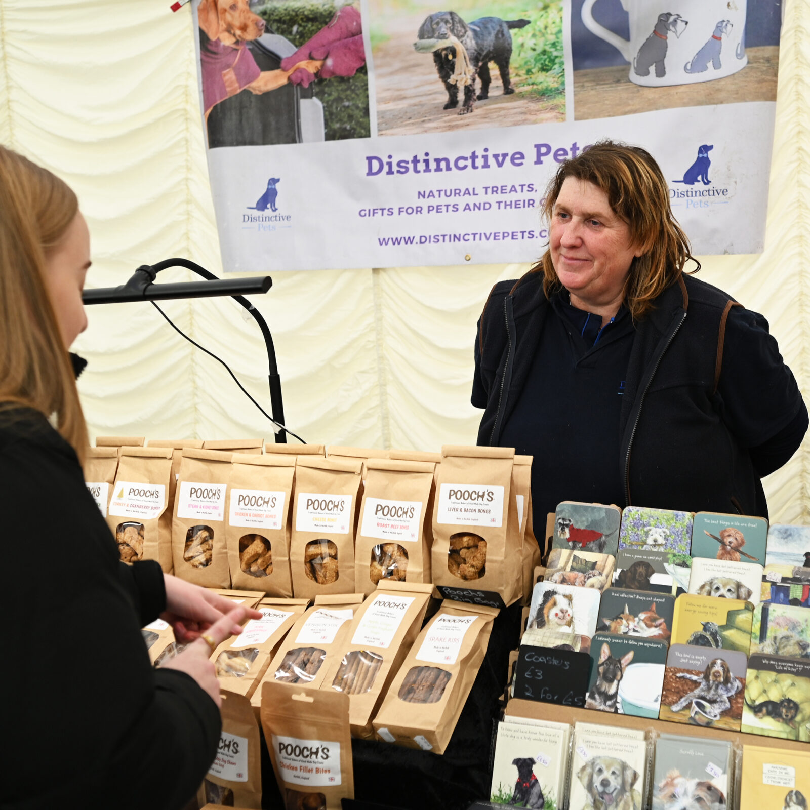 A lady selling dog treats