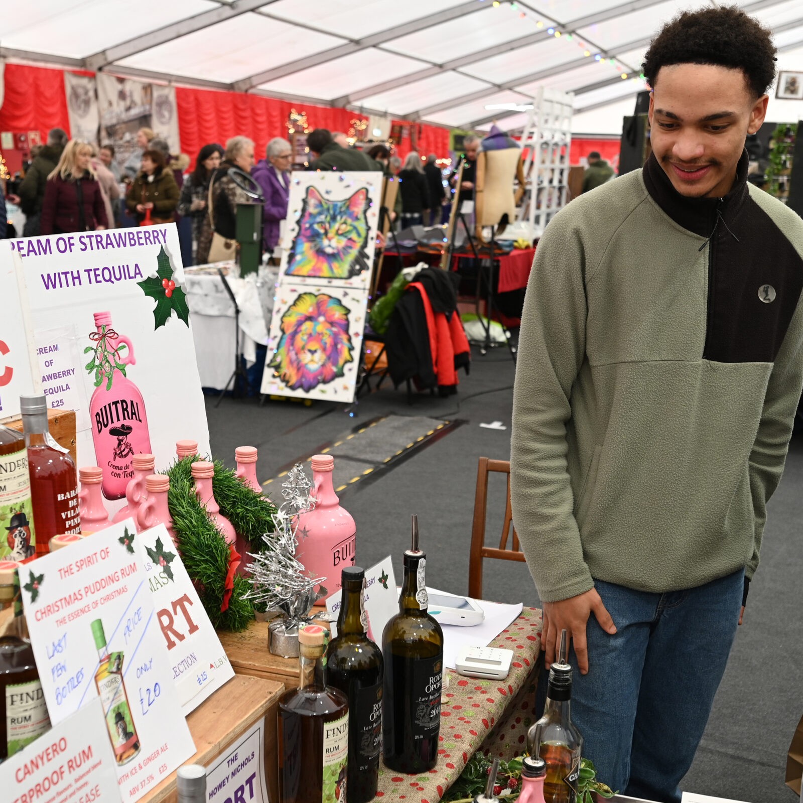 A man selling various liqueurs