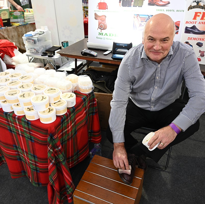 A man selling shoe or leather reviver cream