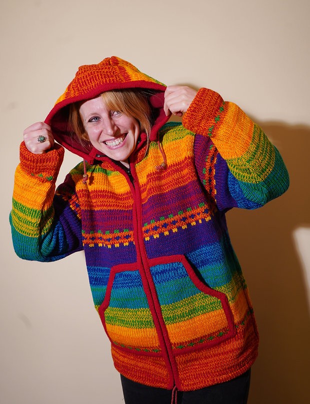 A lady wearing a bright coloured hooded top