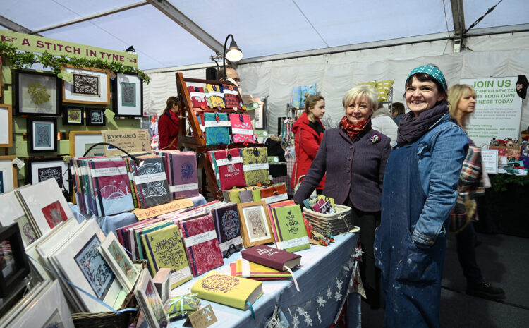 Women selling books and artwork