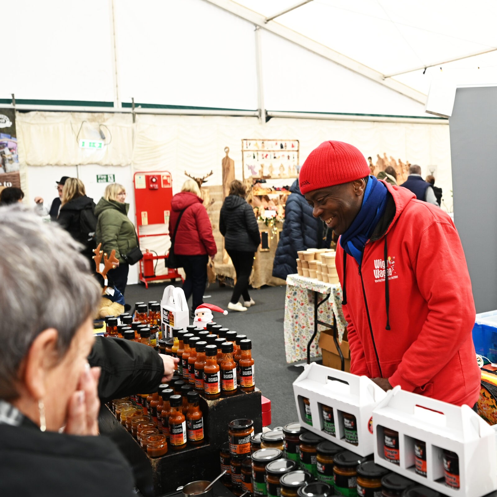 A man selling sauces