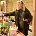 A lady pouring a sample of tea