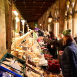 People shopping at a market in the Cloisters of Durham Cathedral