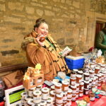 A woman selling condiments