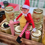 An else sitting in a basket of jars of honey