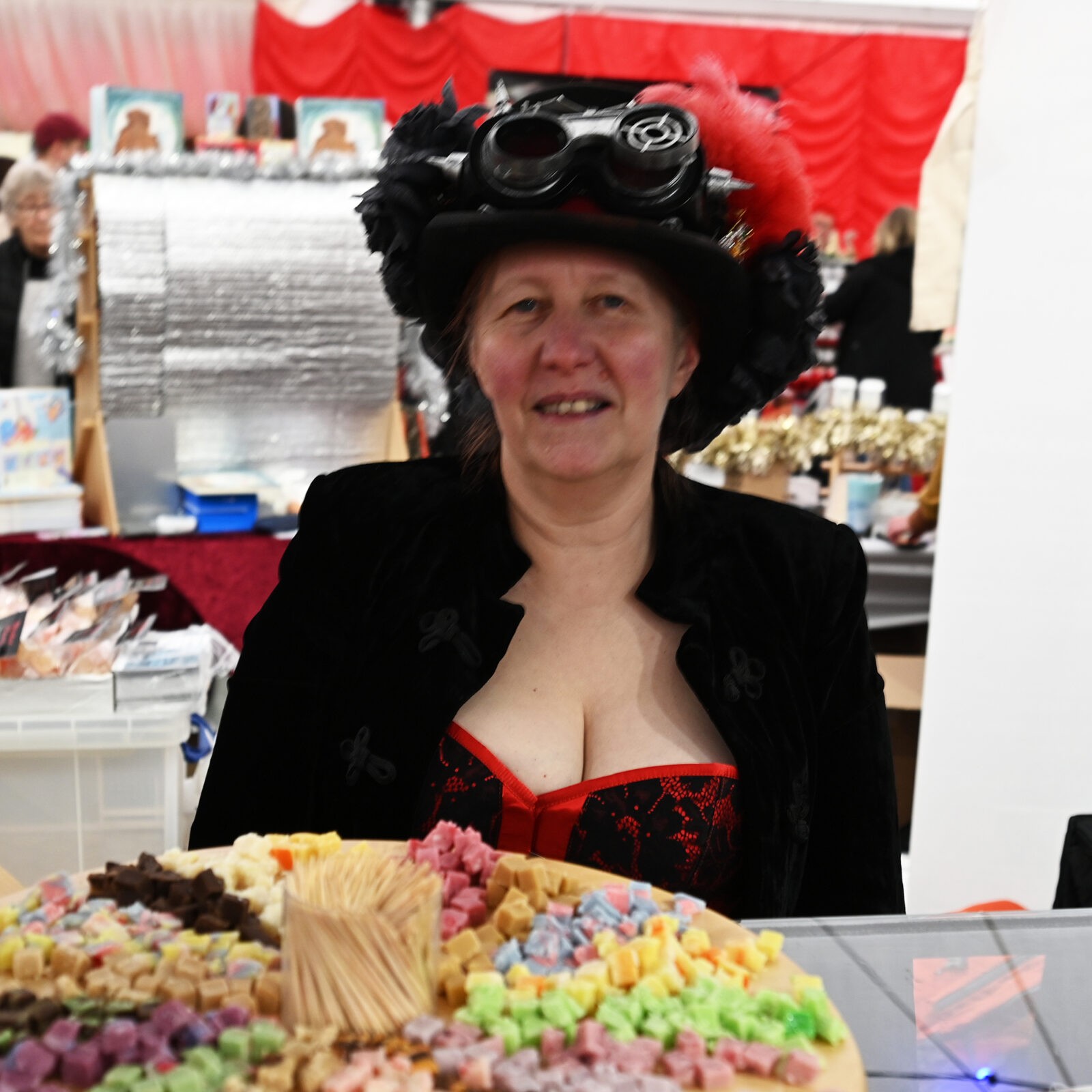 A lady offering samples of fudge