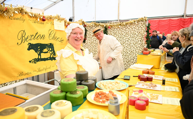 A man and women selling cheese