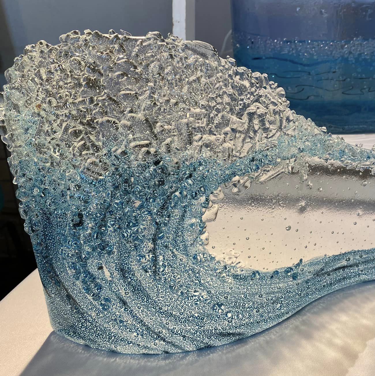 A glass sculpture that looks like a wave