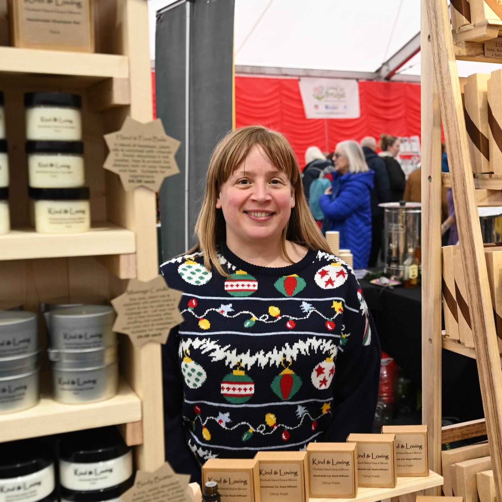 A lady selling Kind & Loving products