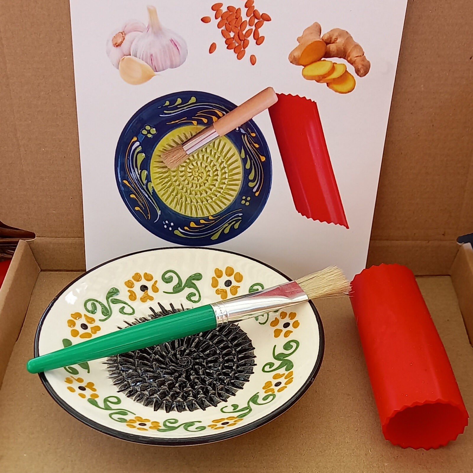 A ceramic bowl and a brush