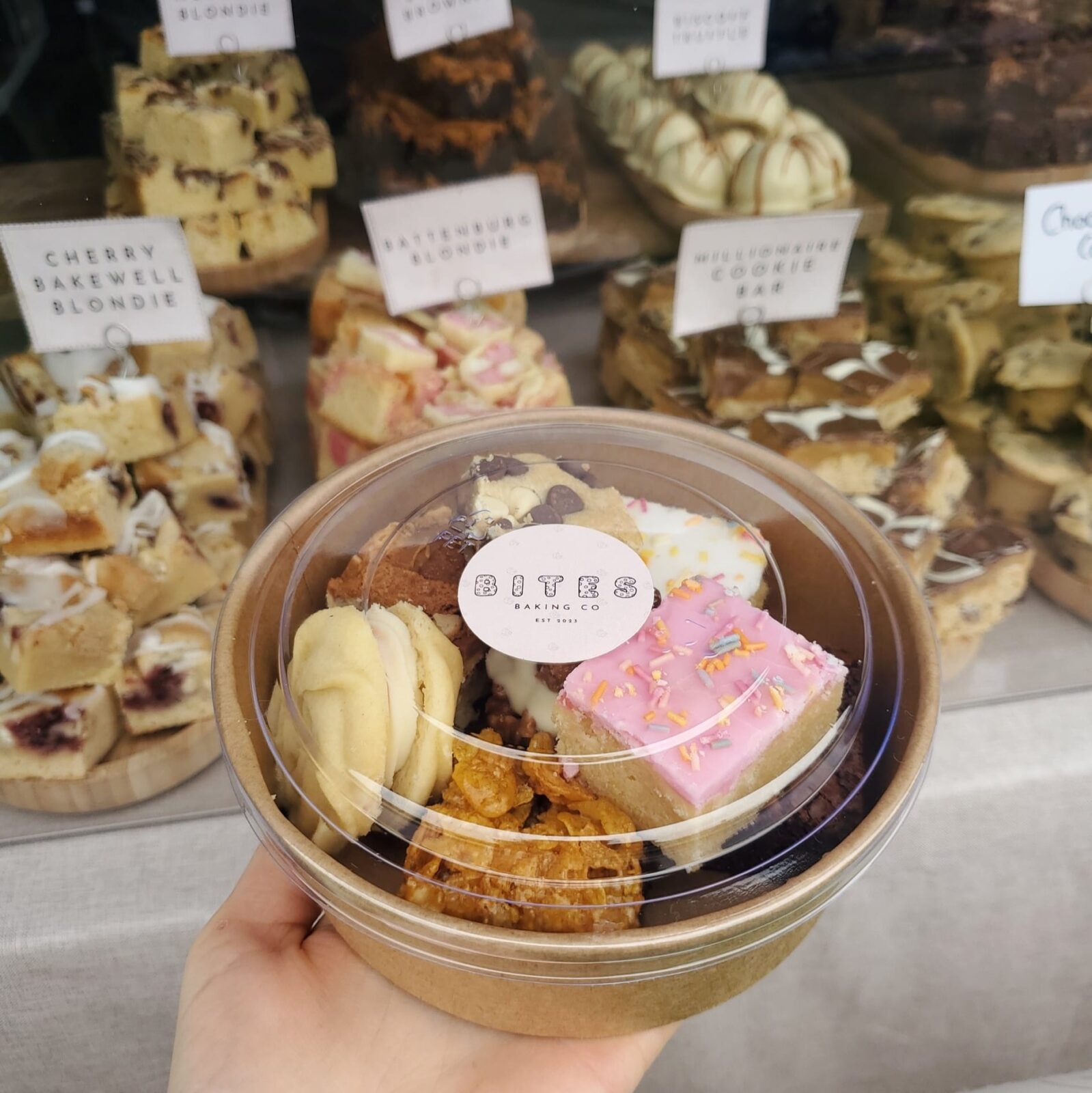 A box containing a variety of small cakes and biscuits