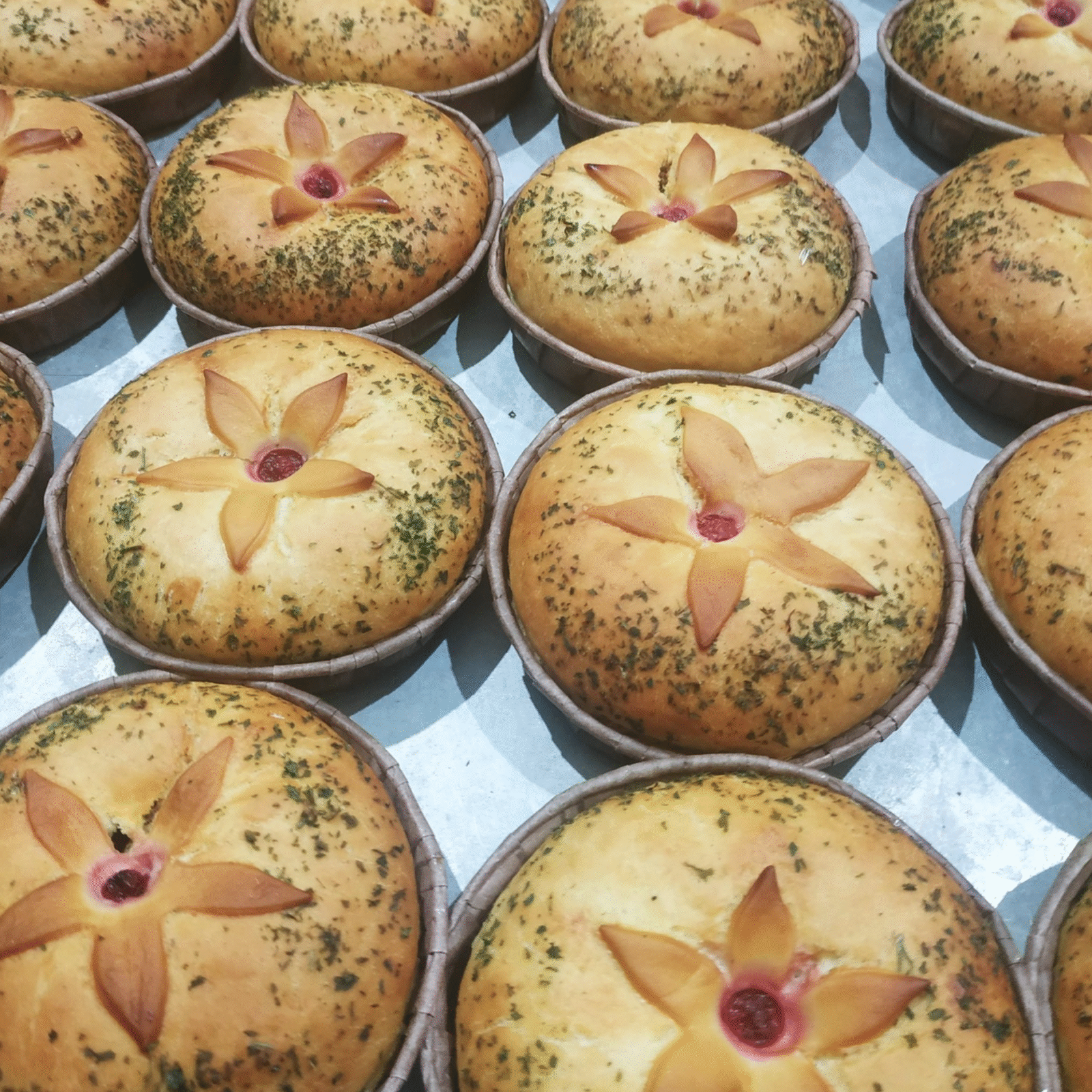 A selection of pies with a flower design on the top