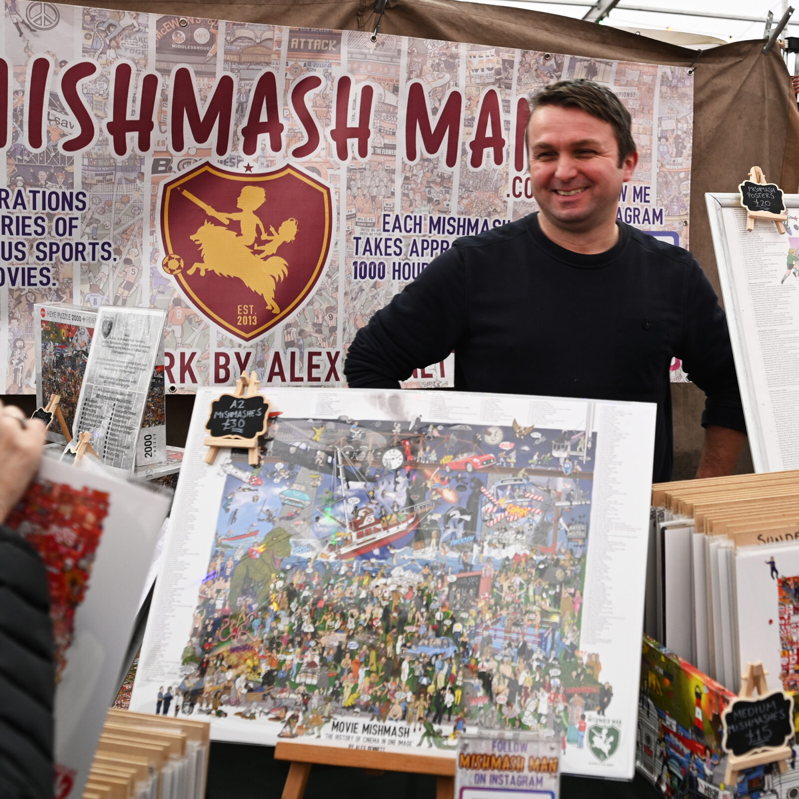 A man selling The Mish Mash Man artwork