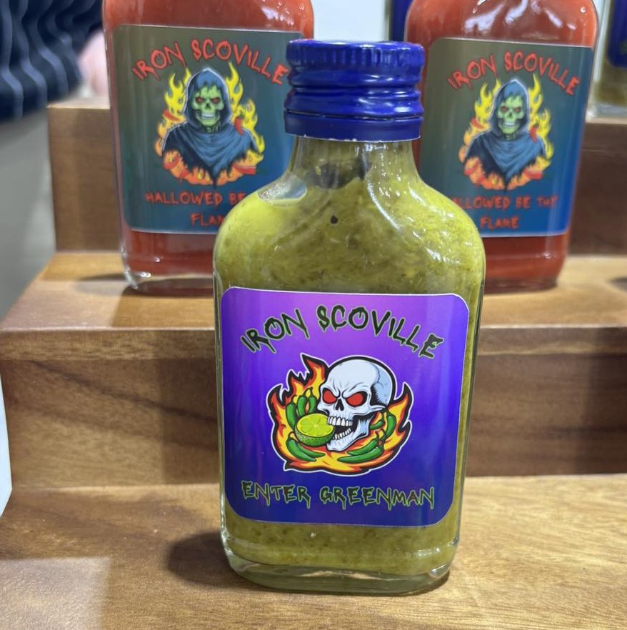 A bottle of green Iron Scoville sauce