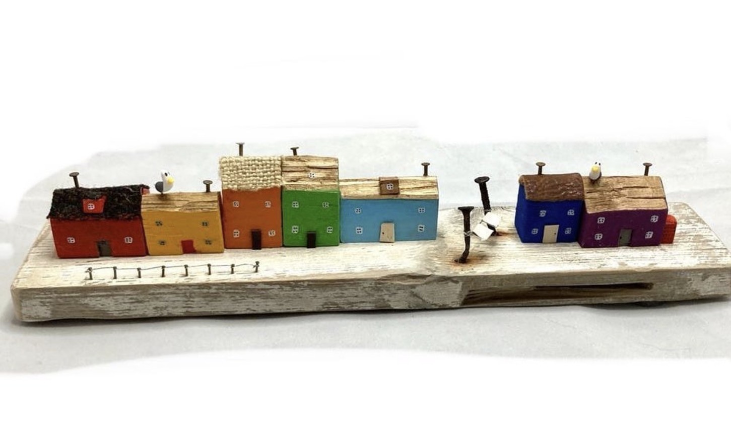 A row of houses created out of driftwood