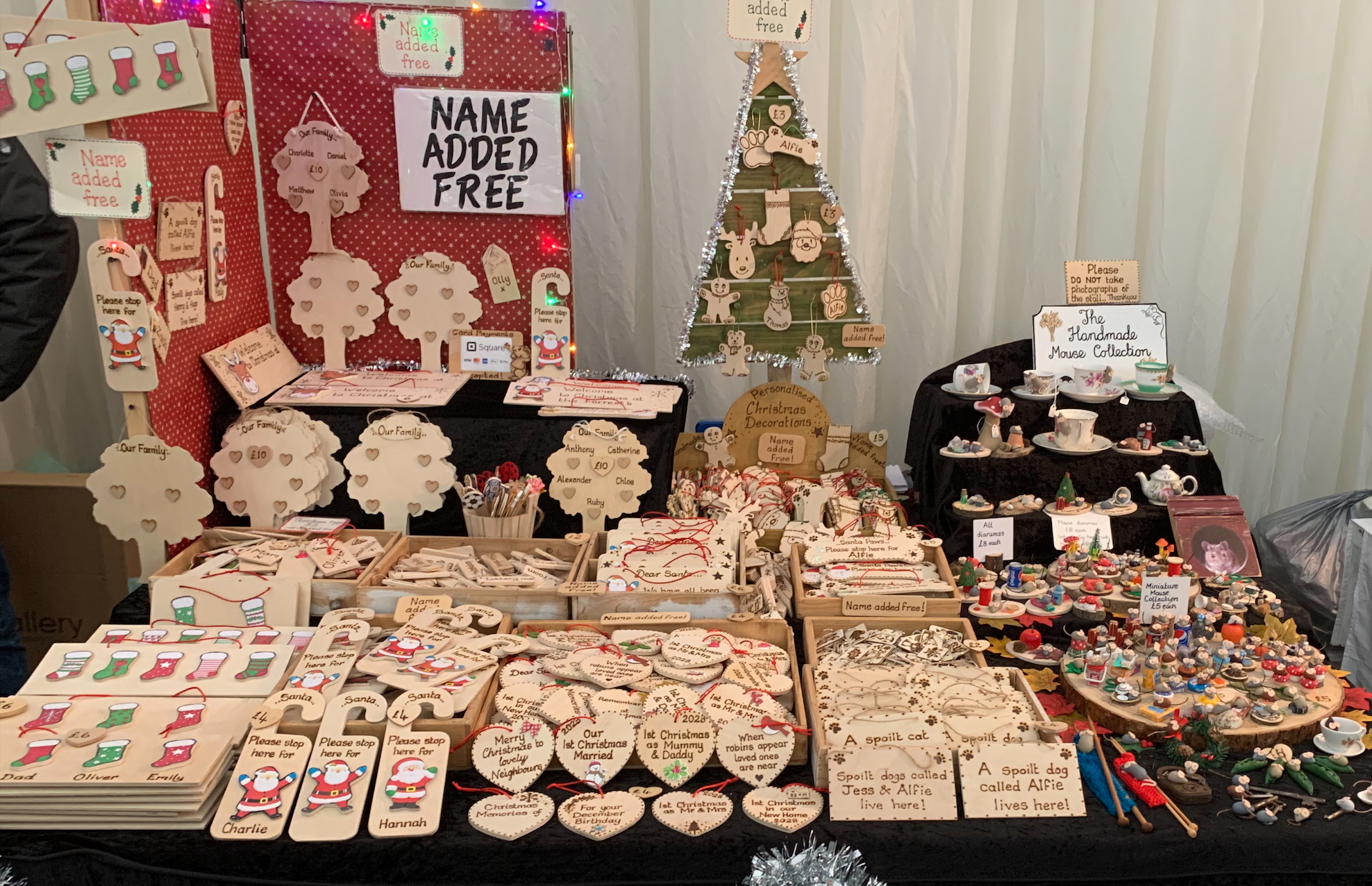 Stall displaying handmade wooden gifts and decorations